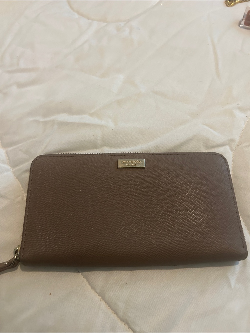 kate spade taupe zip-around wallet with gold-tone logo